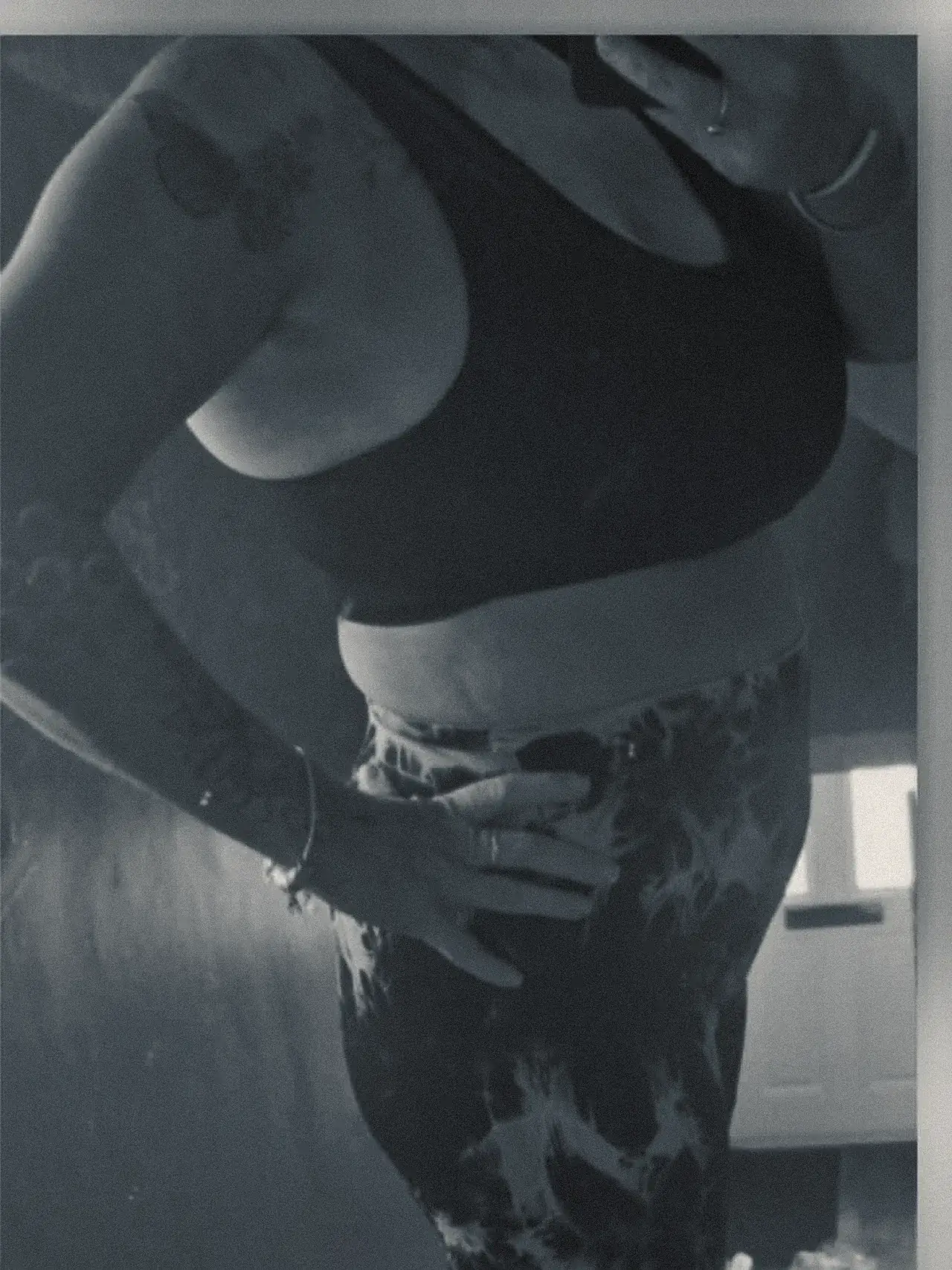 The same client afterwards, with a visibly flatter midsection and more definition